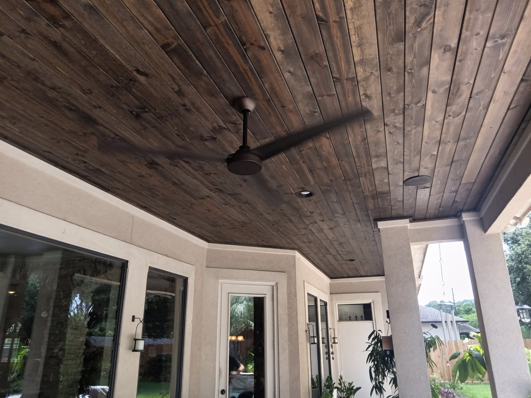 Timber ceiling and ceiling fan in a covered patio built by 2-step Construction